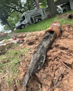 A broken and corroded pipe segment removed during water damage repair by Robert Brown Plumbing, LLC in Bossier City, LA.