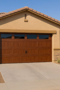 A stylish brown panel garage door with top windows, showcasing a completed installation by Lifetime Garage Door in Las Vegas, NV.