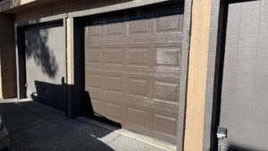 A brown paneled garage door partially open, showing interior, installed by Legacy ODS Garage Door Services in Las Vegas, NV.