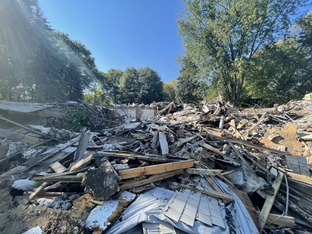A massive pile of building demolition debris after a structure was removed by Rick's Demolition and Concrete Removal in Minneapolis, MN