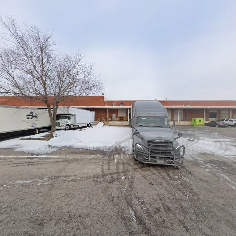 A Capital Relocation Group moving truck parked in a snowy commercial lot in Raleigh, NC.