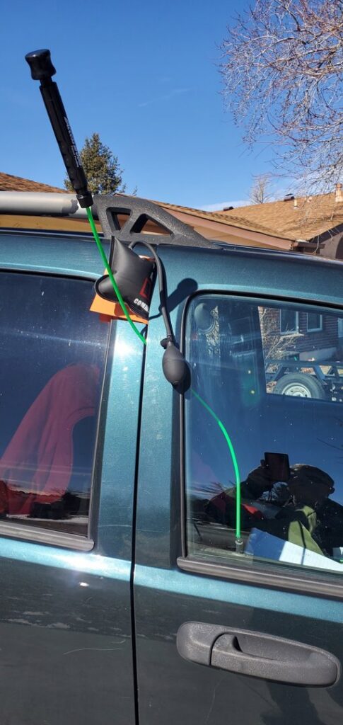 A lockout tool being used on a car door to provide lockout service by Liberty Auto Rescue in Colorado Springs, CO.