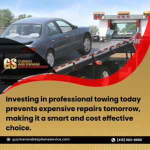 A grey car being loaded onto a flatbed tow truck by Guzman Towing Services in Oakland, CA.