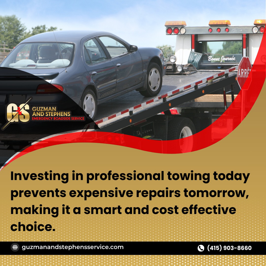 A grey car being loaded onto a flatbed tow truck by Guzman Towing Services in Oakland, CA.