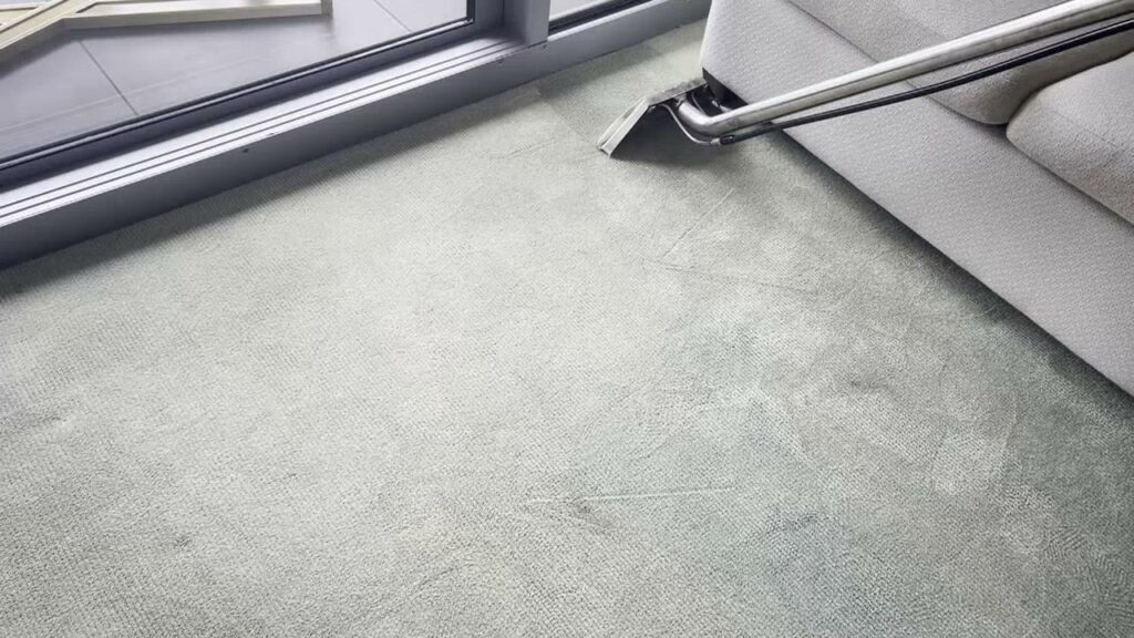 A professional carpet cleaning wand performing water extraction on a light-colored carpet by Renue Systems Of Oahu in Honolulu, HI