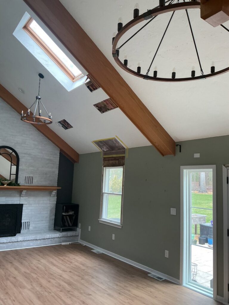 Exposed ceiling beams and removed drywall indicating water damage restoration work by RestoPros in Norfolk County, MA.