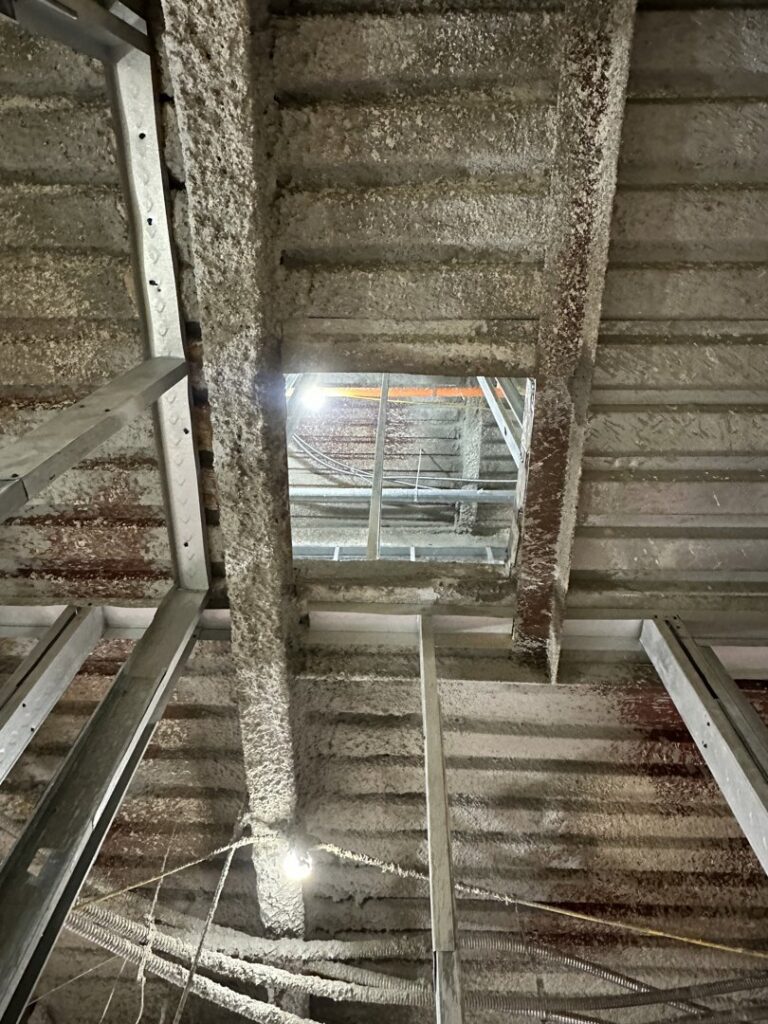 A rectangular opening precisely cut into a concrete ceiling, showcasing demolition work by Valute Demolition in Jacksonville, FL.
