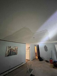 A ceiling showing significant water damage and stains, indicating a need for remediation by RestoPros of Hartford in West Hartford, CT.