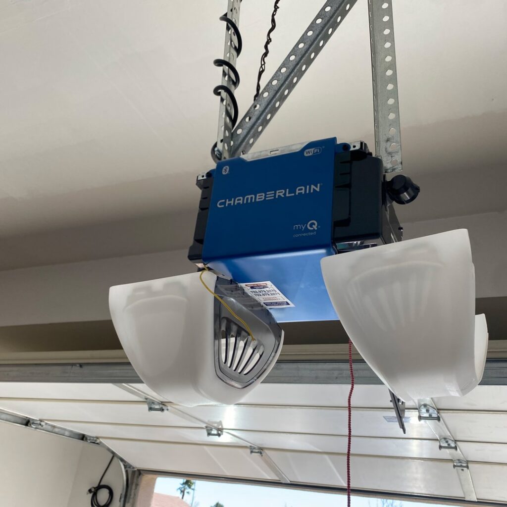 A close-up of a Chamberlain myQ smart garage door opener, representing the modern equipment installed and serviced by American Veteran Garage Door Repair Henderson, NV.