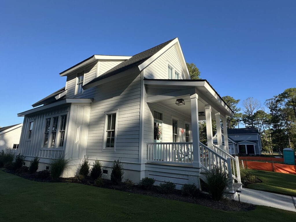 A beautiful home with classic white siding completed by Cordell Exteriors Inc in Chesapeake, VA