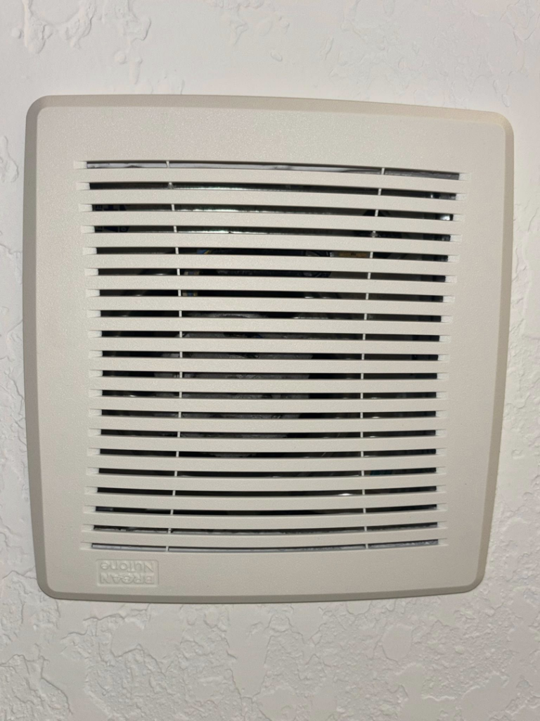 A spotless bathroom exhaust fan, expertly cleaned by Saari's Cleaning Services LLC in Jacksonville, FL.