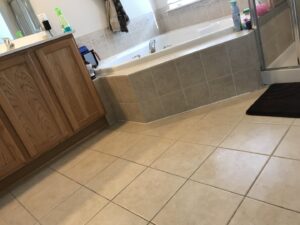 A clean bathroom floor and sparkling tub, showcasing the work of West & Co Cleaning Services in Laurel, MD