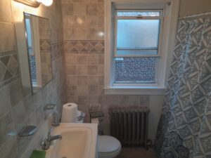 A pristine bathroom interior, expertly cleaned by Whole New World Cleaning Service, LLC in Wilmington, DE