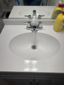 A sparkling clean bathroom sink and faucet after cleaning by V's Residential Cleaning Services in Tacoma, WA.
