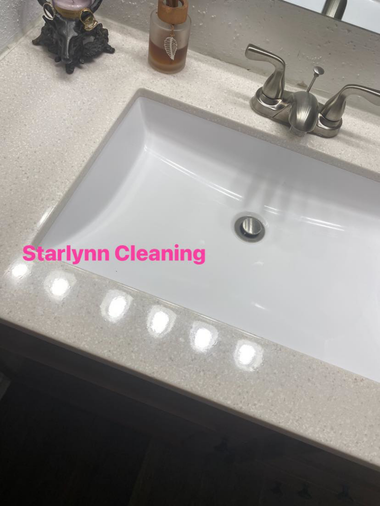 A sparkling clean bathroom sink and countertop after a professional cleaning service by Starlynn Cleaning LLC in Dayton, OH.