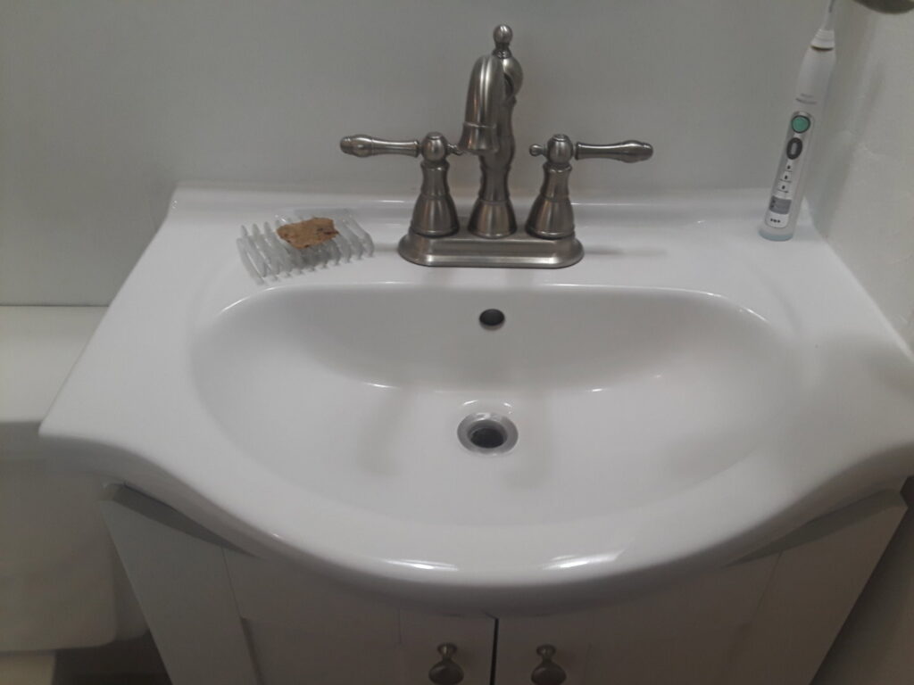 A clean bathroom sink and faucet after professional cleaning by Ady's Housekeeping in Yakima, WA