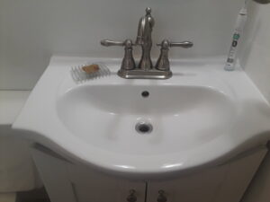 A clean bathroom sink and faucet after professional cleaning by Ady's Housekeeping in Yakima, WA