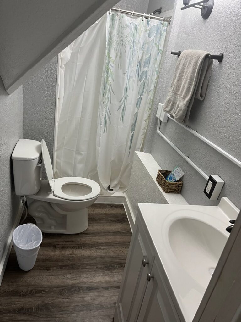 A fully cleaned bathroom featuring a toilet, sink, and shower, demonstrating the comprehensive service of Final Touch & More in Fort Wayne, IN