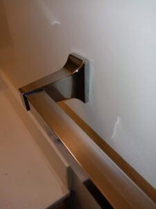 A polished and clean bathroom towel bar by Whole New World Cleaning Service, LLC in Wilmington, DE
