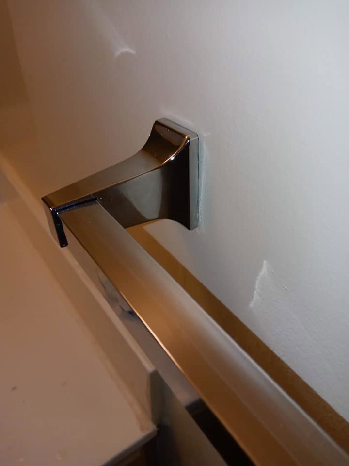 A polished and clean bathroom towel bar by Whole New World Cleaning Service, LLC in Wilmington, DE