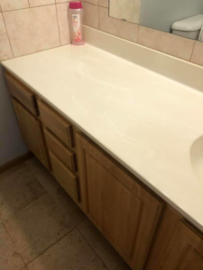 A sparkling clean bathroom vanity and countertop after professional cleaning by RA Cleaning Services in Brockton, MA.