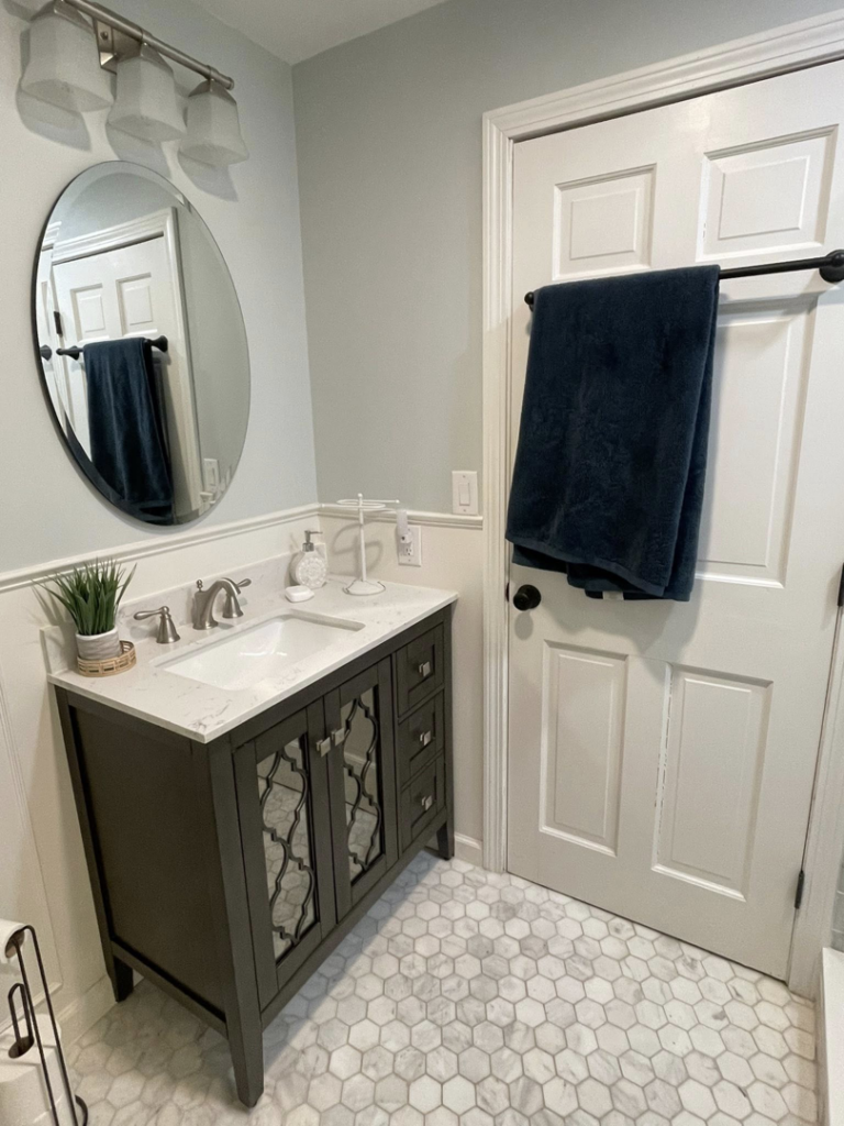 A sparkling clean bathroom vanity and mirror, showcasing the quality house cleaning by Straight Up Cleaning in South Portland, ME.