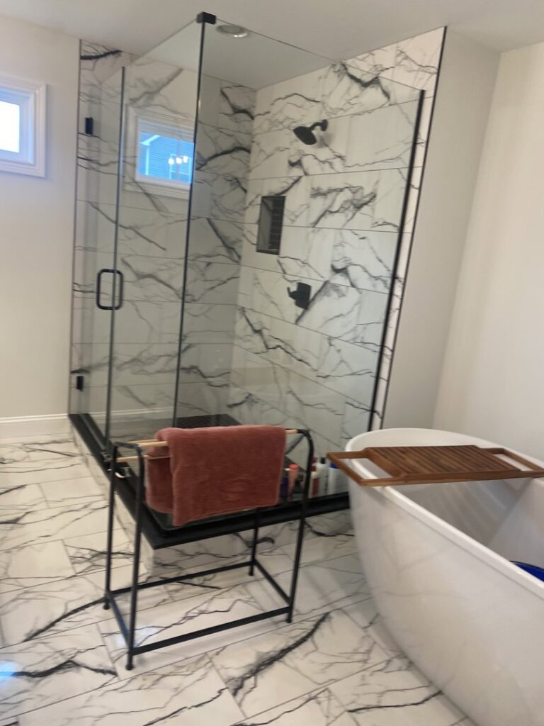 A spotless bathroom featuring a walk-in shower and a freestanding tub, cleaned by Bee Clean Solutions in Lexington, KY.