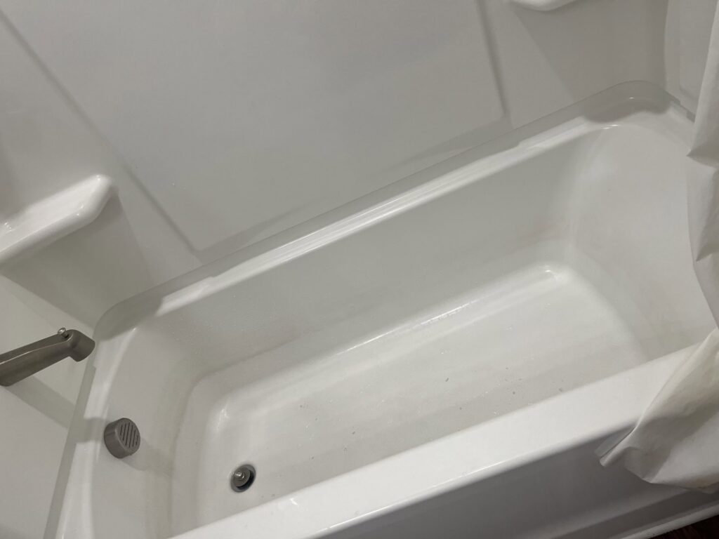 A sparkling clean bathtub after professional cleaning, demonstrating the quality work of Royal Madam Cleaning LLC in Charlotte, NC.