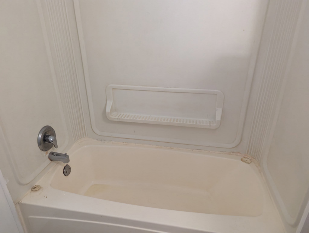 A sparkling clean bathtub after a thorough cleaning service provided by The Cleaning Fairy in Fort Lauderdale, FL.