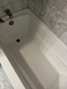 A sparkling clean bathtub after professional cleaning by Lorena Lyons Cleaning in Concord, NH.