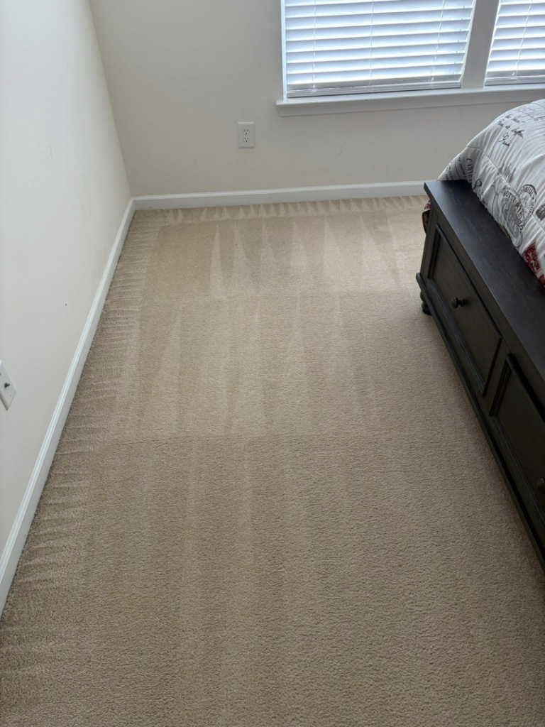 A clean bedroom carpet showing fresh vacuum lines from Five Star Cleaning Service in Pasadena, MD.