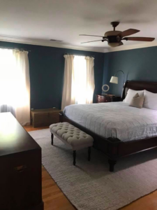 A neatly made and clean bedroom, showcasing house cleaning service results by A'La Carte Clean in Virginia Beach, VA.