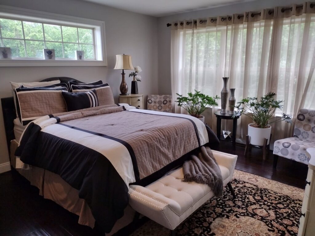 A beautifully clean bedroom with a large bed, elegant decor, and plants, reflecting the meticulous cleaning services of Rivas Molina's Cleaning LLC in Dundalk, MD.