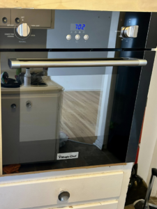 A clean, shiny built-in oven in a kitchen, reflecting the quality appliance cleaning by Elite A&C Cleaning, LLC in Casper, WY.