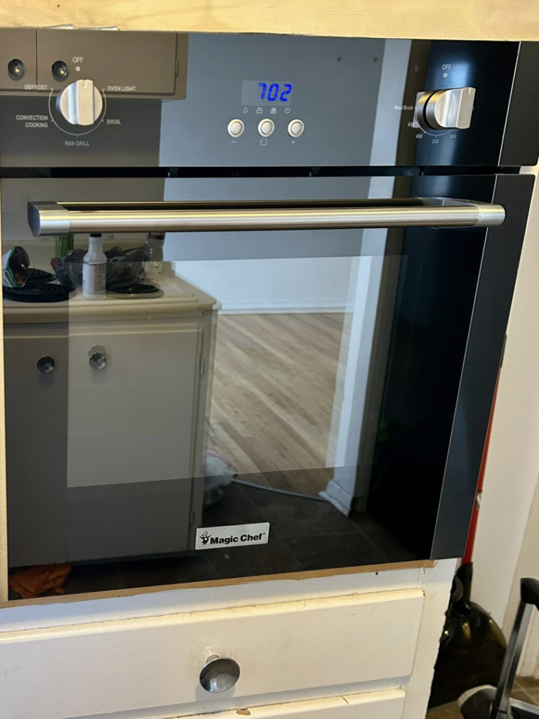 A clean, shiny built-in oven in a kitchen, reflecting the quality appliance cleaning by Elite A&C Cleaning, LLC in Casper, WY.