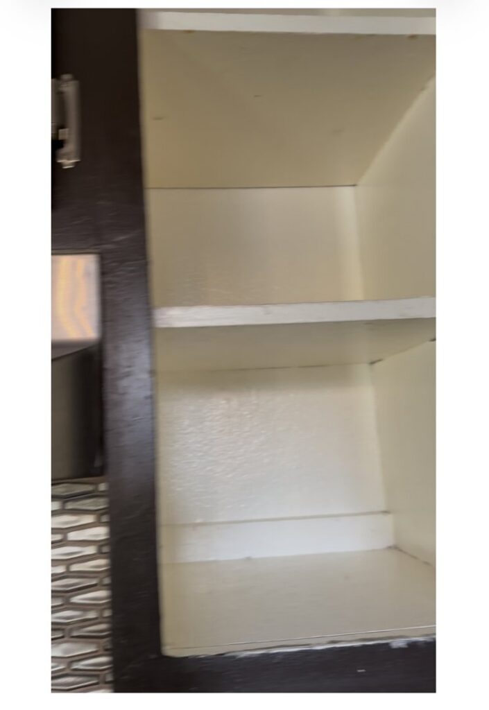 Clean cabinet shelves, showcasing the results of a professional cleaning by Bee-Dazzled Cleaning Service in Long Beach, CA.