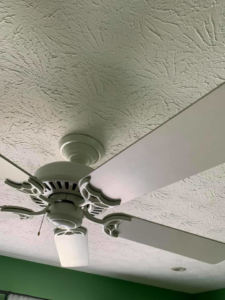 A thoroughly cleaned ceiling fan with spotless blades, a service offered by Remy the Cleaner in Indianapolis, IN.