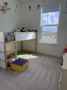 A bright and clean child's bedroom with a bunk bed and tidy carpet, cleaned by Nichole's Cleaning Service in Fort Wayne, IN