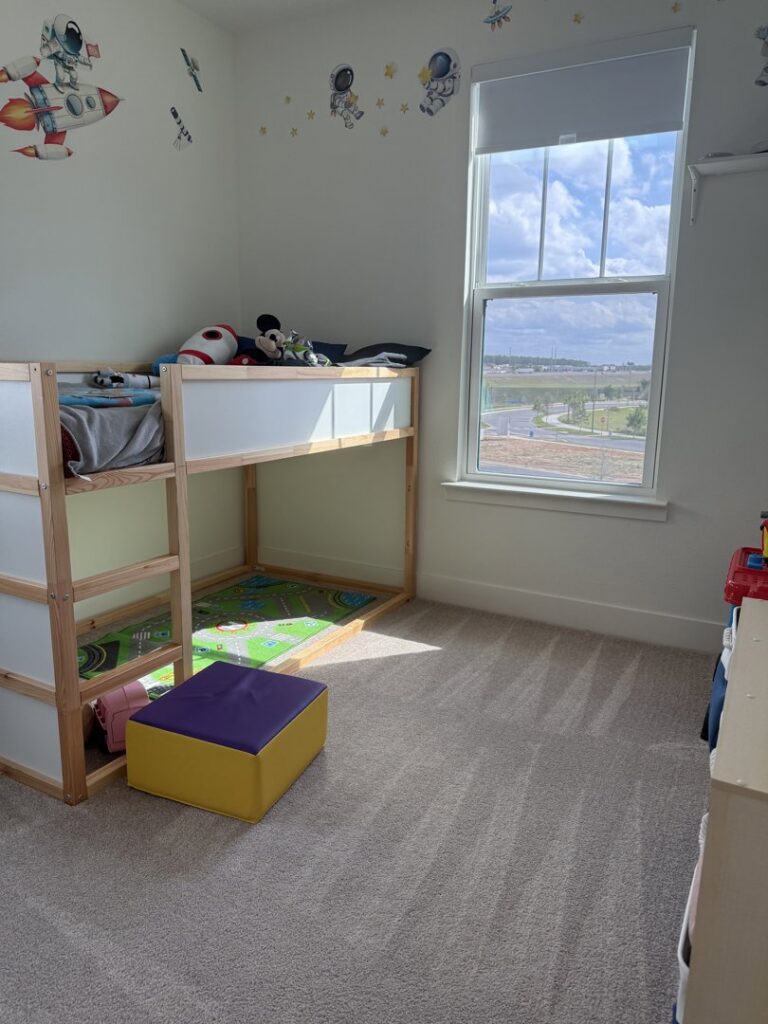 A bright and clean child's bedroom with a bunk bed and tidy carpet, cleaned by Nichole's Cleaning Service in Fort Wayne, IN