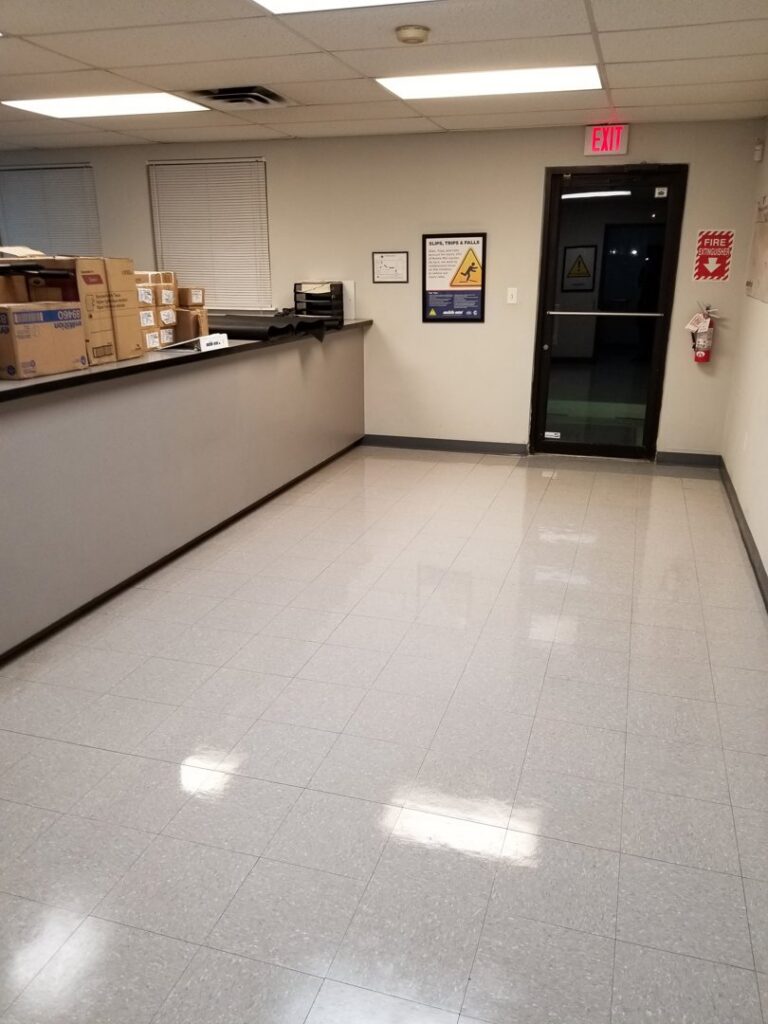 A shiny, clean tiled floor in a commercial office space by Cooper-N-Folks in Philadelphia, PA