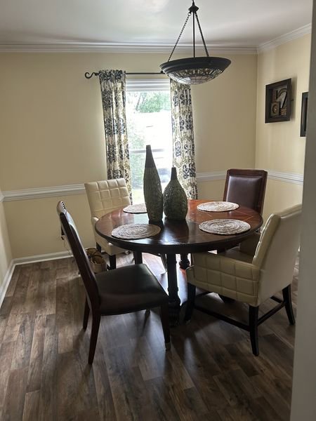 A clean and tidy dining room, showcasing the results of a house cleaner's work by Time To Shine Cleaning Services in Round Rock, TX.