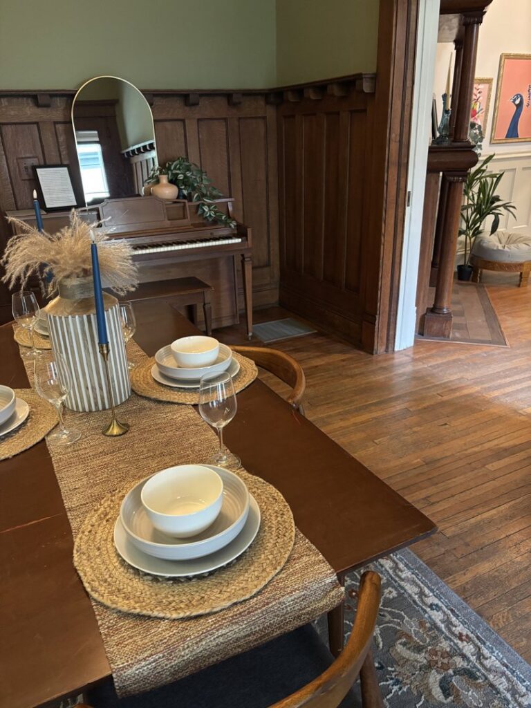 A beautifully clean dining room table with place settings, ready for guests, cleaned by Maid In Indy in Indianapolis, IN.