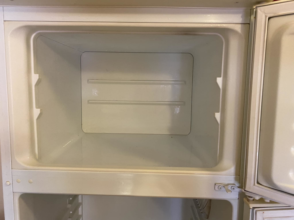 A sparkling clean and empty freezer compartment, showcasing the deep cleaning services by Seabirds Cleaning in Saco, ME.
