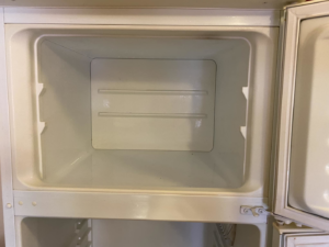 A sparkling clean and empty freezer compartment, showcasing the deep cleaning services by Seabirds Cleaning in Saco, ME.