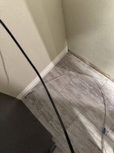A clean floor and baseboard area behind a kitchen appliance after cleaning by Grant Cleaning in Missoula, MT.