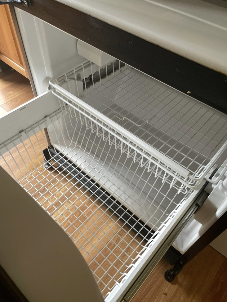A spotless freezer compartment with clean racks, demonstrating the thorough cleaning provided by Crystal Clear Cleaning Services in New Haven, CT