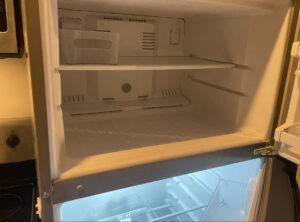 A clean and empty freezer compartment, showcasing the detailed cleaning services provided by Merriweather Cleaning and Laundry in Vancouver, WA.