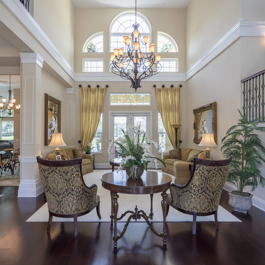 A grand, clean living room and foyer, showcasing the results of Nooks and Crannies Cleaning Services in Norfolk, VA.