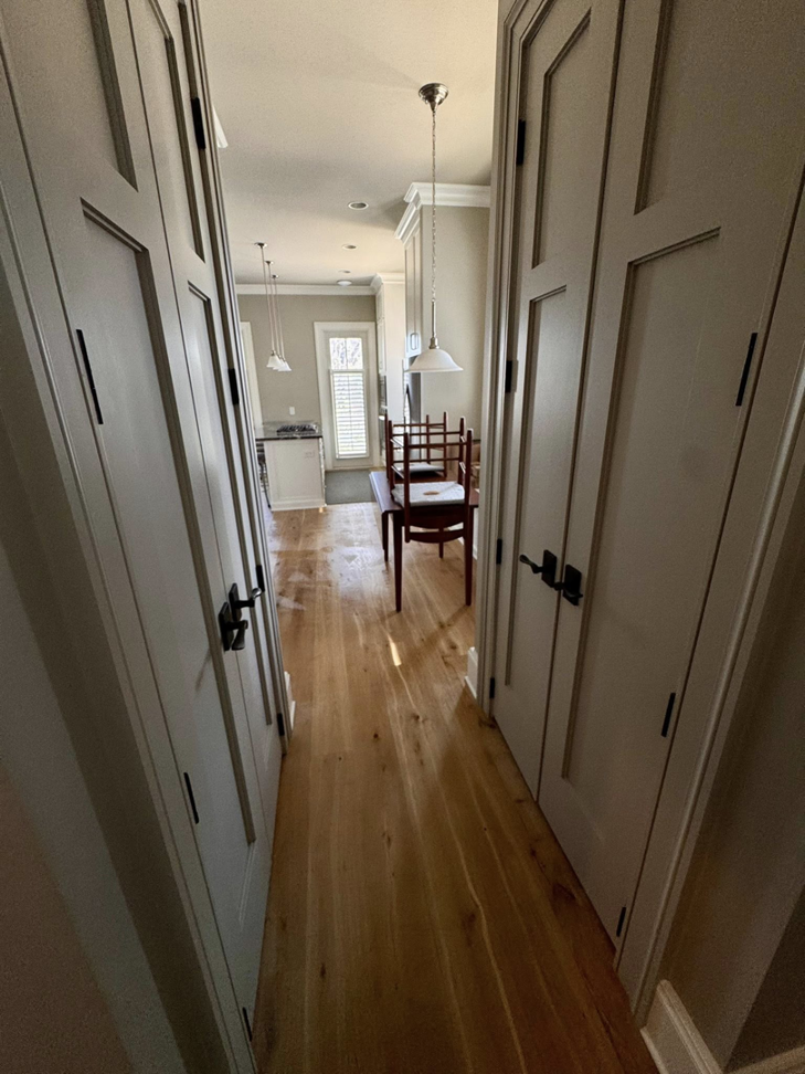 A clean hallway with polished hardwood floors, maintained by Affordable Cleaning in North Charleston, SC.