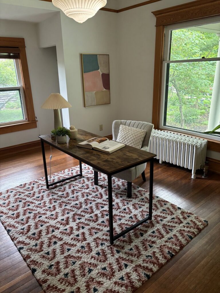 A clean and organized home office with a desk and chair, maintained by Maid In Indy in Indianapolis, IN.